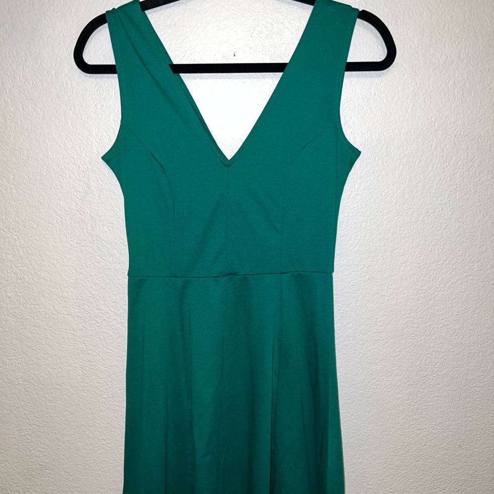 H&M dress size small. Sits above the knee.
